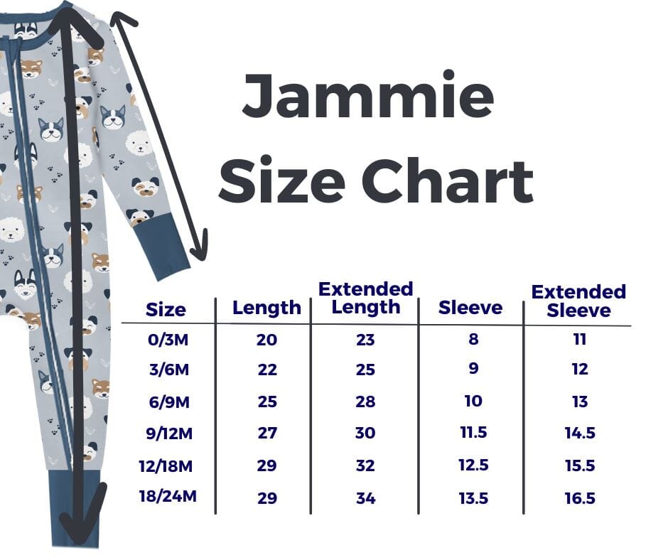 Nature Bamboo Pajamas Size Chart" showing a light blue pajama with dog faces and paw prints. Arrows mark measurements: length (shoulder to bottom), sleeve (shoulder to wrist), extended length, and sleeve with cuffs. Sizes: 0/3M (length 20-23, sleeve 8-11), 3/6M (length 22-25, sleeve 9-12), 6/9M (length 25-28, sleeve 10-13), 9/12M (length 27-30, sleeve 11.5-14.5), 12/18M (length 29-32, sleeve 12.5-15.5), 18/24M (length 29-34, sleeve 13.5-16.5).