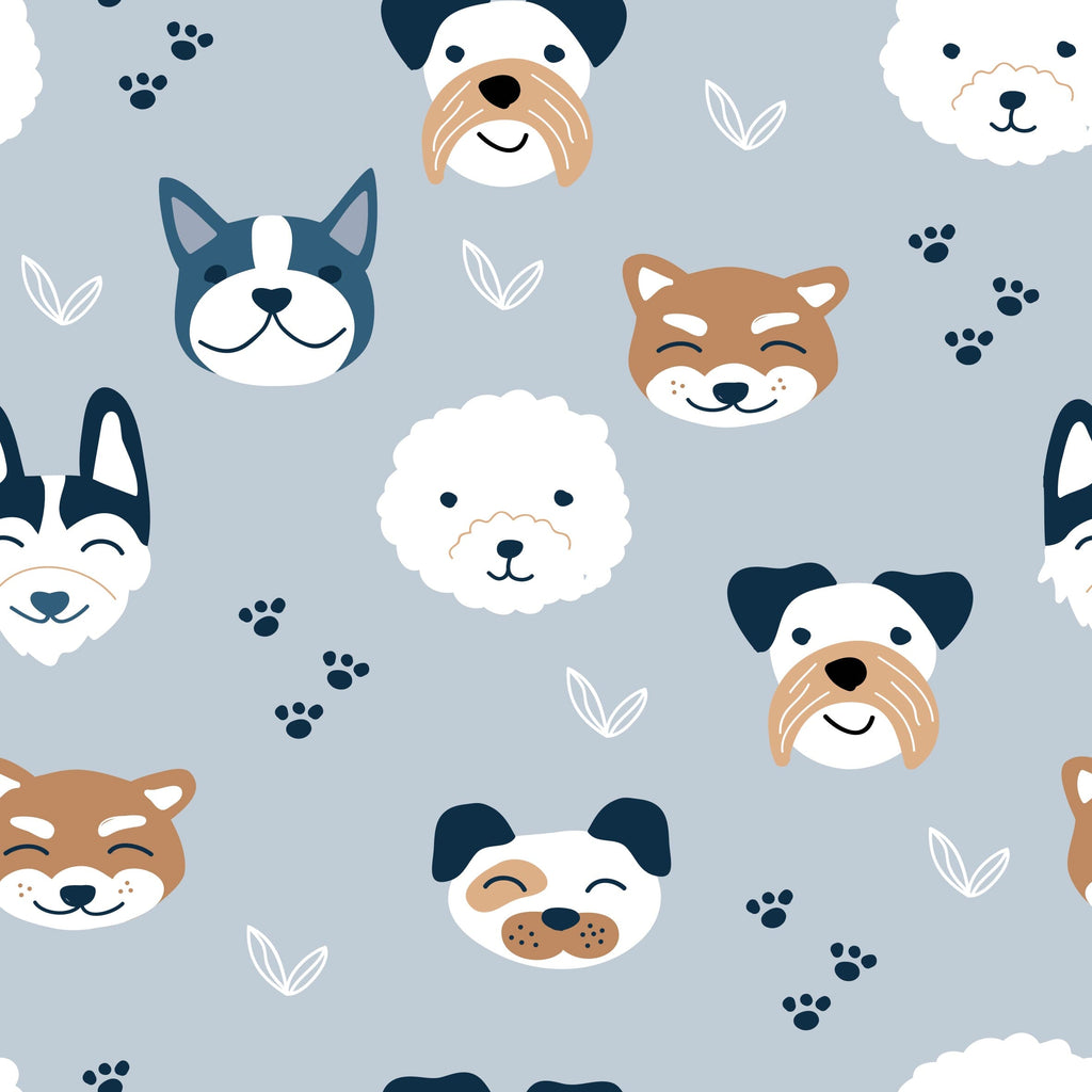 Slumberpup a close up design pattern with light blue background and various dog faces and small white leaves and navy blue paw prints. The dog faces include a variety of breeds such as a white poodle, a brown and white bulldog, a white and gray husky, a light brown Shiba Inu, a black and white French bulldog, and a gray and white Boston terrier.