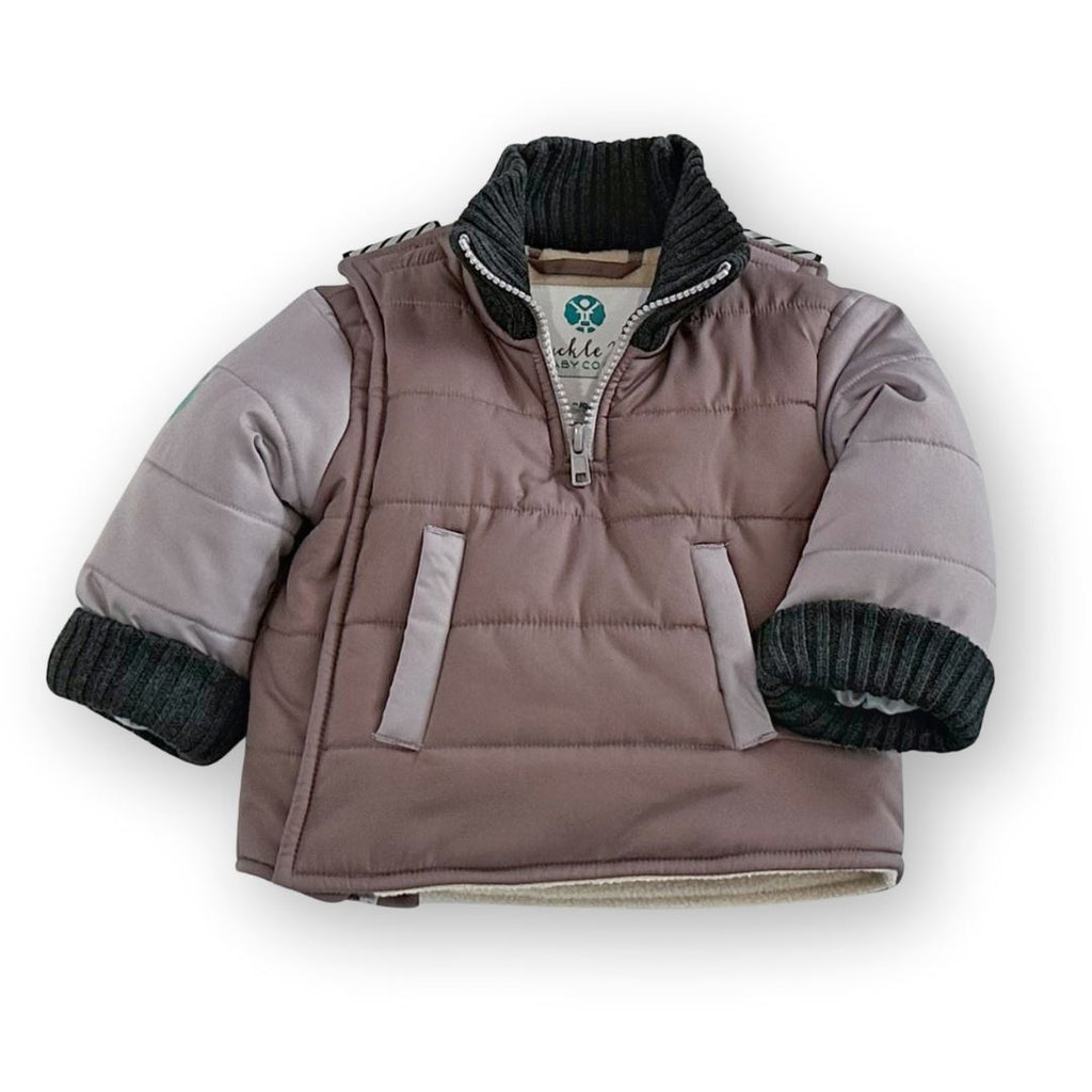 The Adventurer/Brown/Grey
Brown carseat coat with grey sleeves and charcoal grey cuffs is displayed on a white background.  The 1/4 zip neck is unzipped.