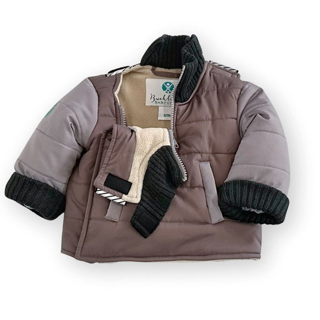 The Adventurer/Brown/Grey
Brown car seat coat is partially unzipped to show the 1/4 zip neckline and split back neckline.  The charcoal grey cuffs are rolled up to show a shorter sleeve length option.