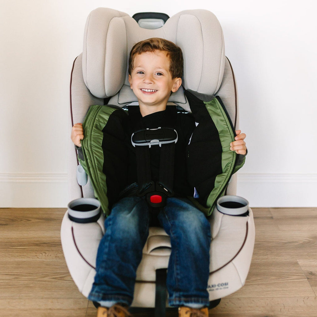 Puff/Green 
Little boy with brown hair is wearing a green car seat coat.  The boy is sitting in a tan carseat.  The car seat coat is open showing the buckled harness.  The boy is smiling.