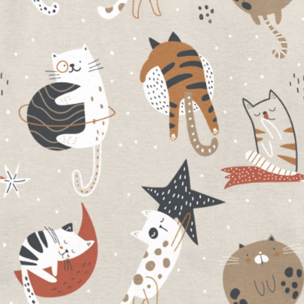 Cool Cat Jams Big Kids a playful pattern featuring various cats in whimsical poses. The cats are illustrated in shades of black, white, orange, and brown, with distinct markings and expressions. They are surrounded by abstract star and moon shapes in white and red against a light brown background with scattered white dots.